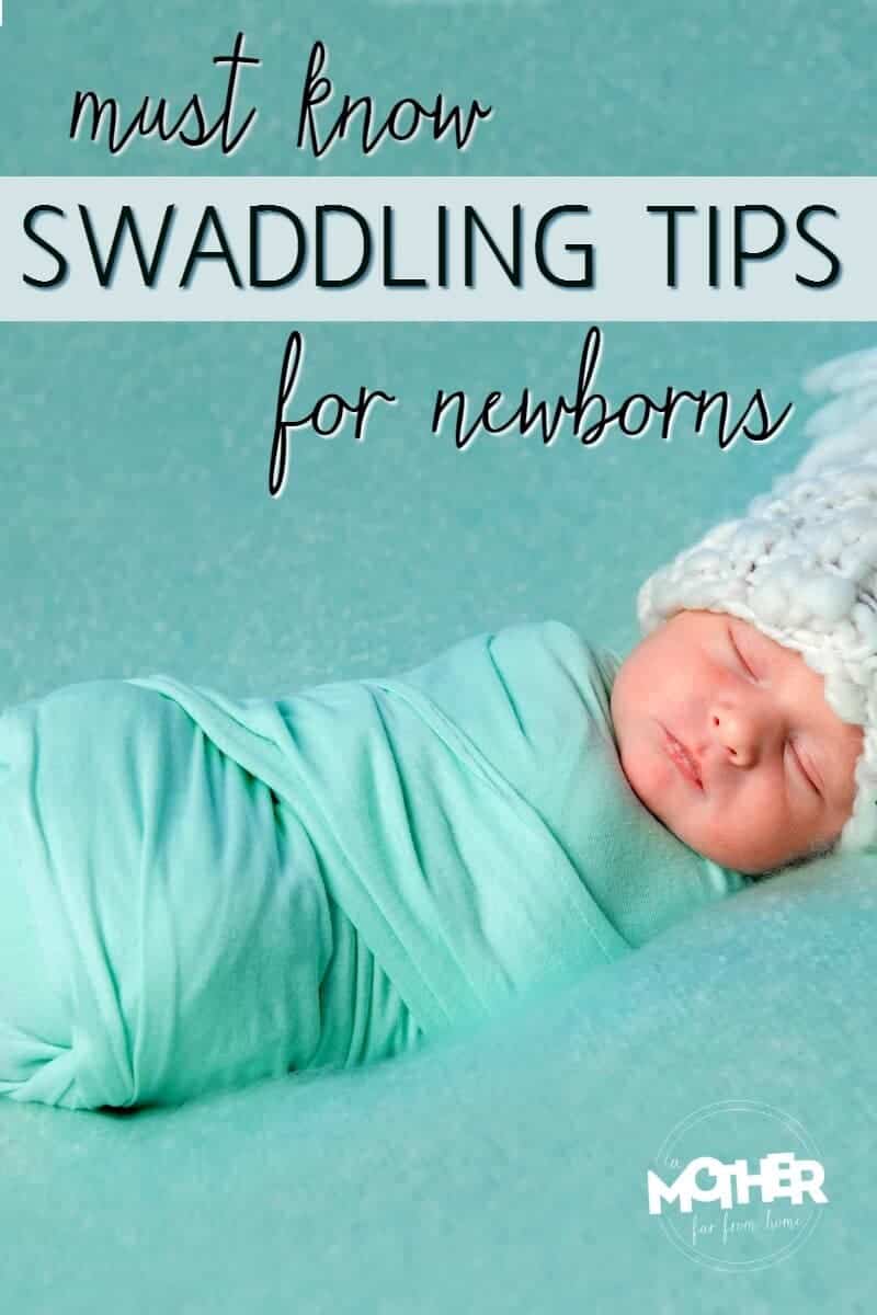 newborn baby who is swaddled resting 