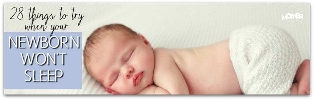 little baby lying on stomach sleeping with bottom in air on white blanket