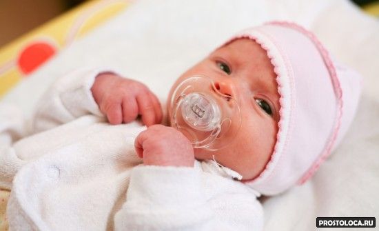 Adorable baby with pacifier