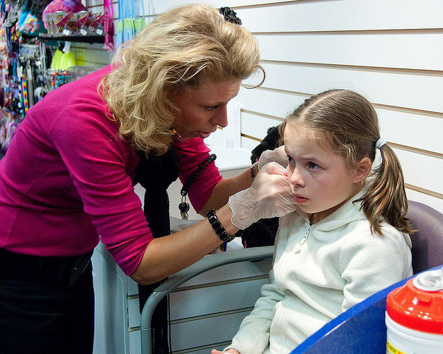 Girl Getting Ears Pierced